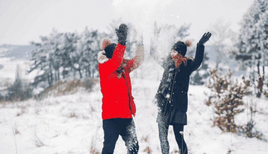 couple playing with snow in kashmir